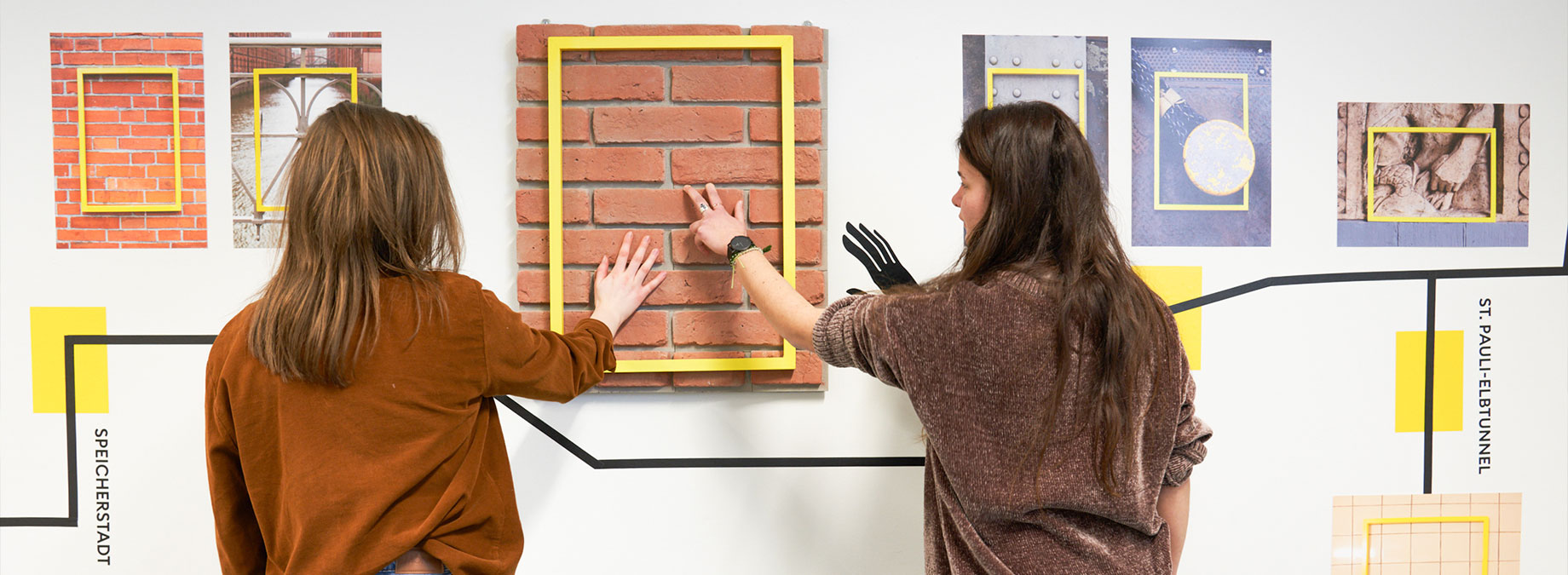 Students touching an art project