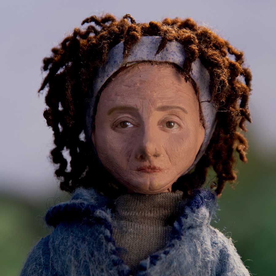 a puppet with curly hair