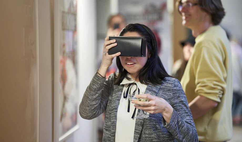 a woman looking through vr glasses