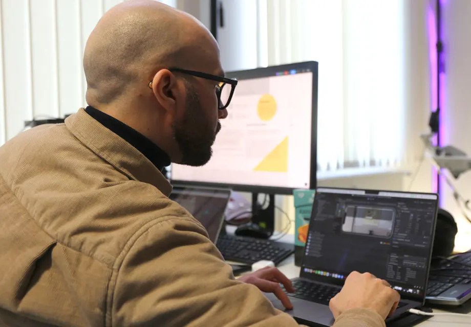 a man sitting in front of technical equipment