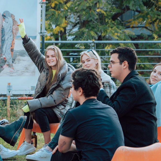 Students enjoying together on terrace