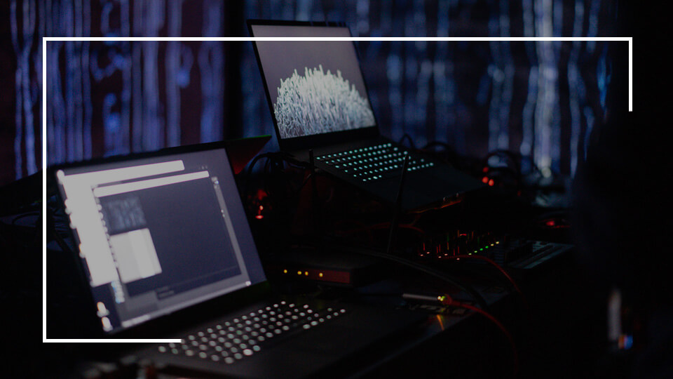 two laptops in a dark atmosphere