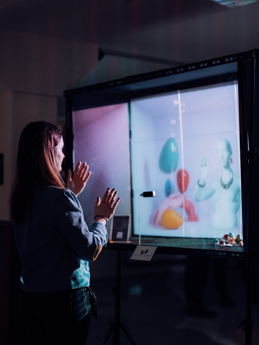 Woman interacting with digital art installation