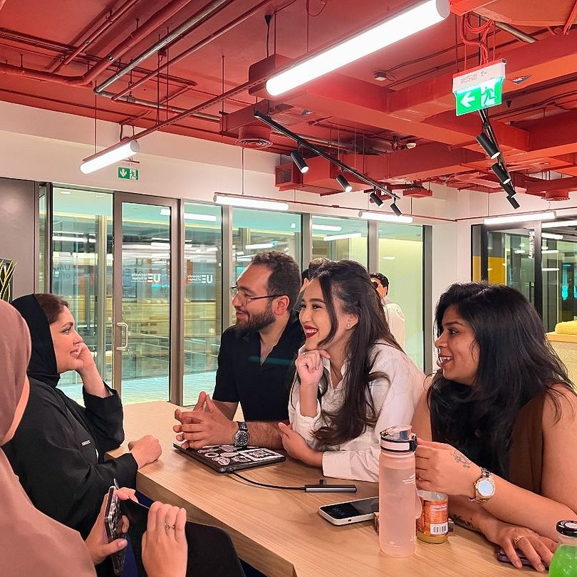 a group of people sitting at a table