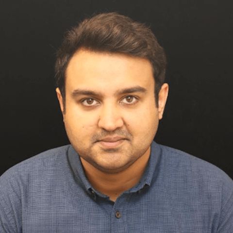 a man in a blue shirt