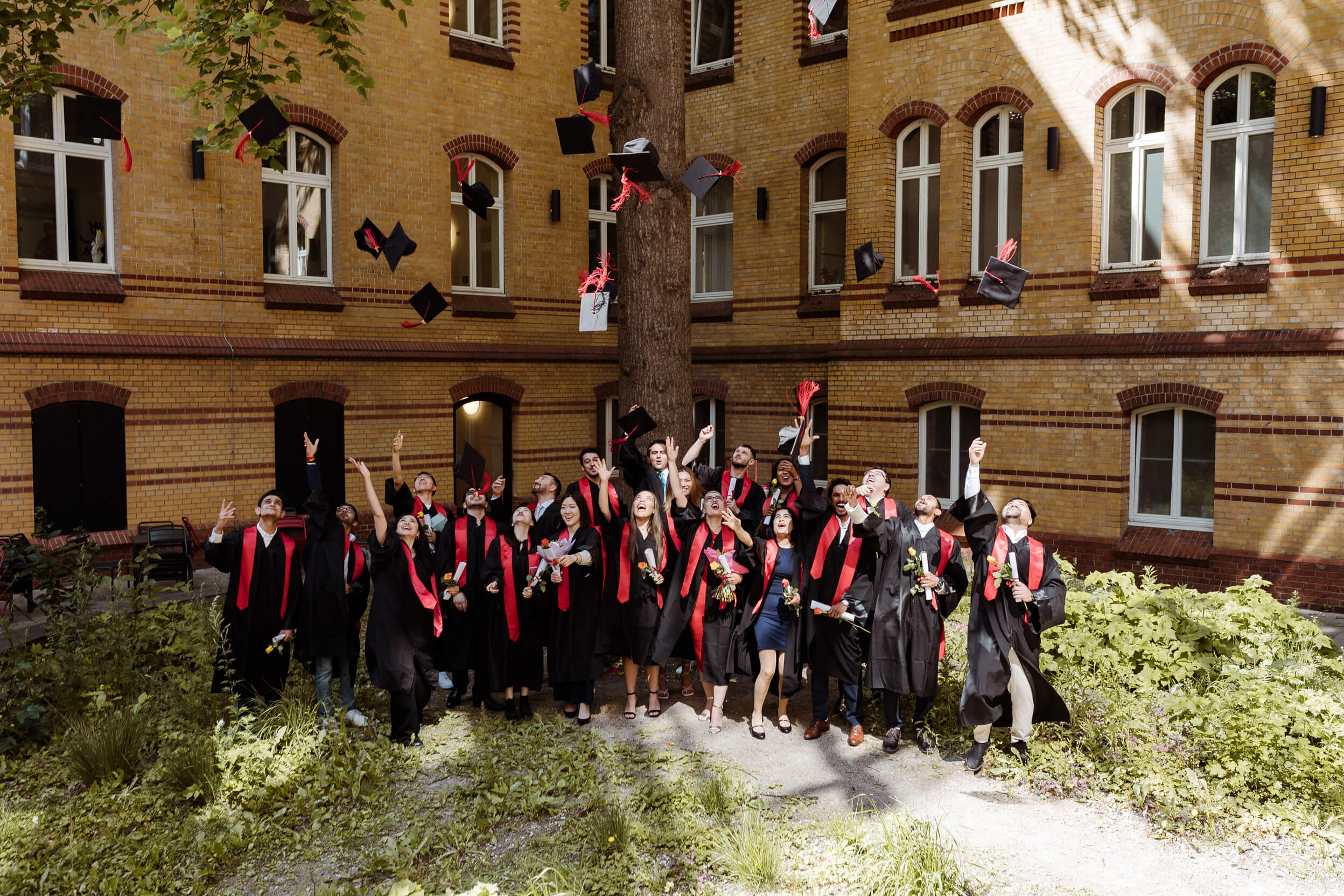 Graduates throwing their caps in the air