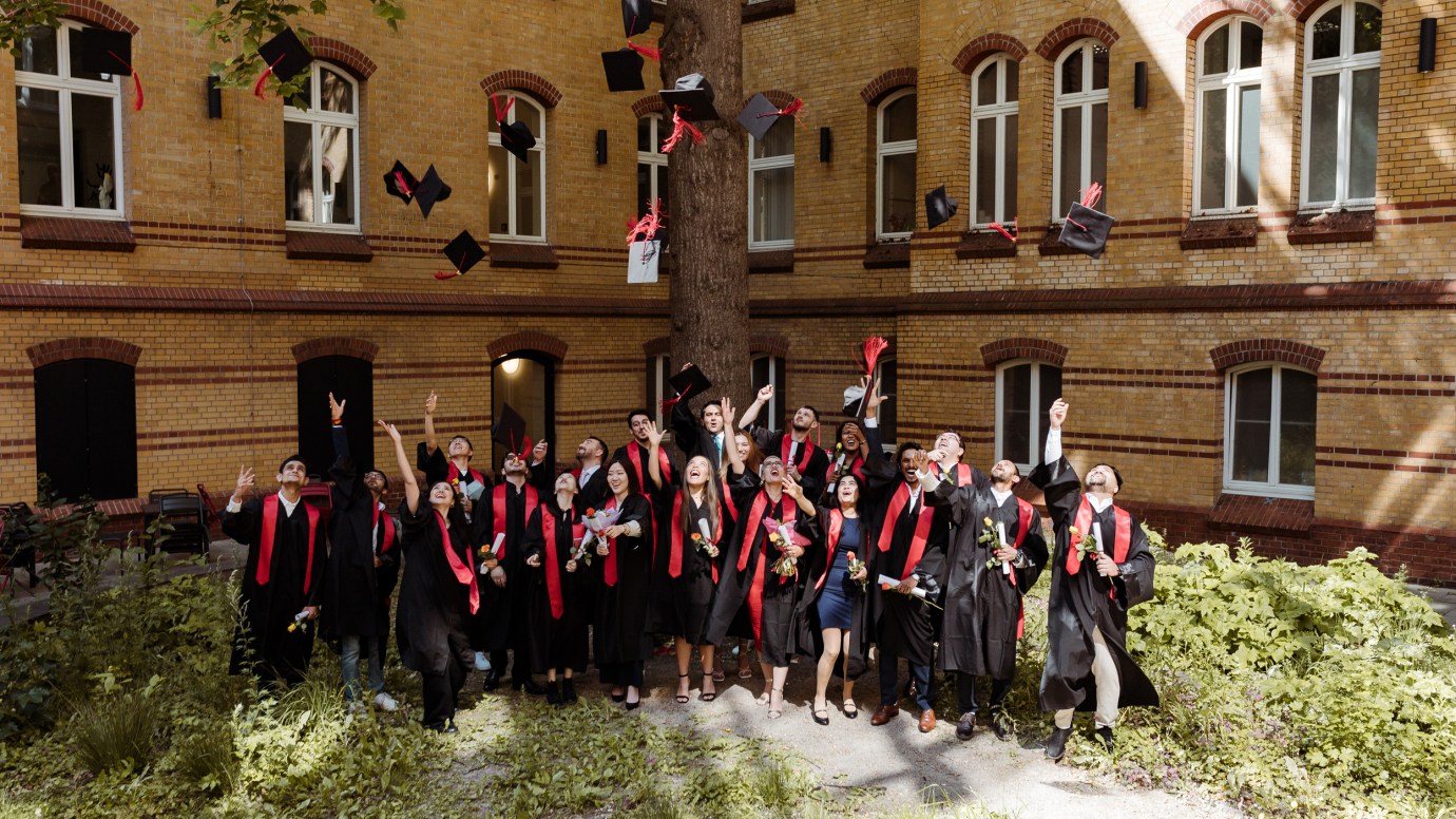 Graduates throwing their caps in the air