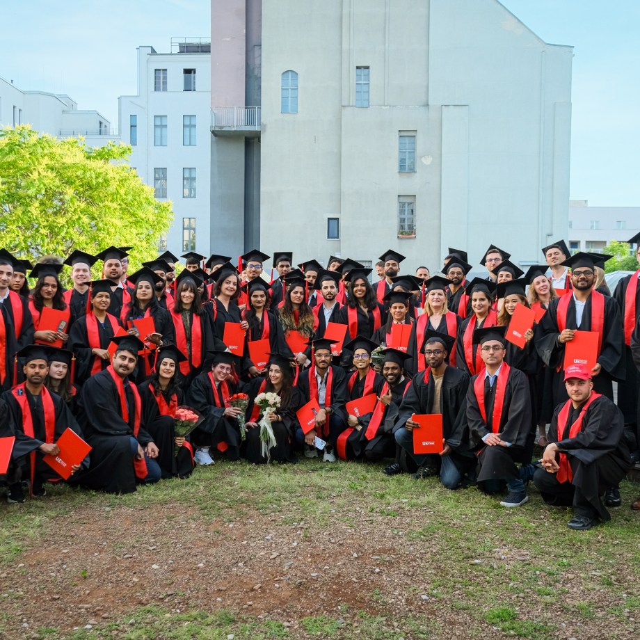 A group of graduates posing for a photo