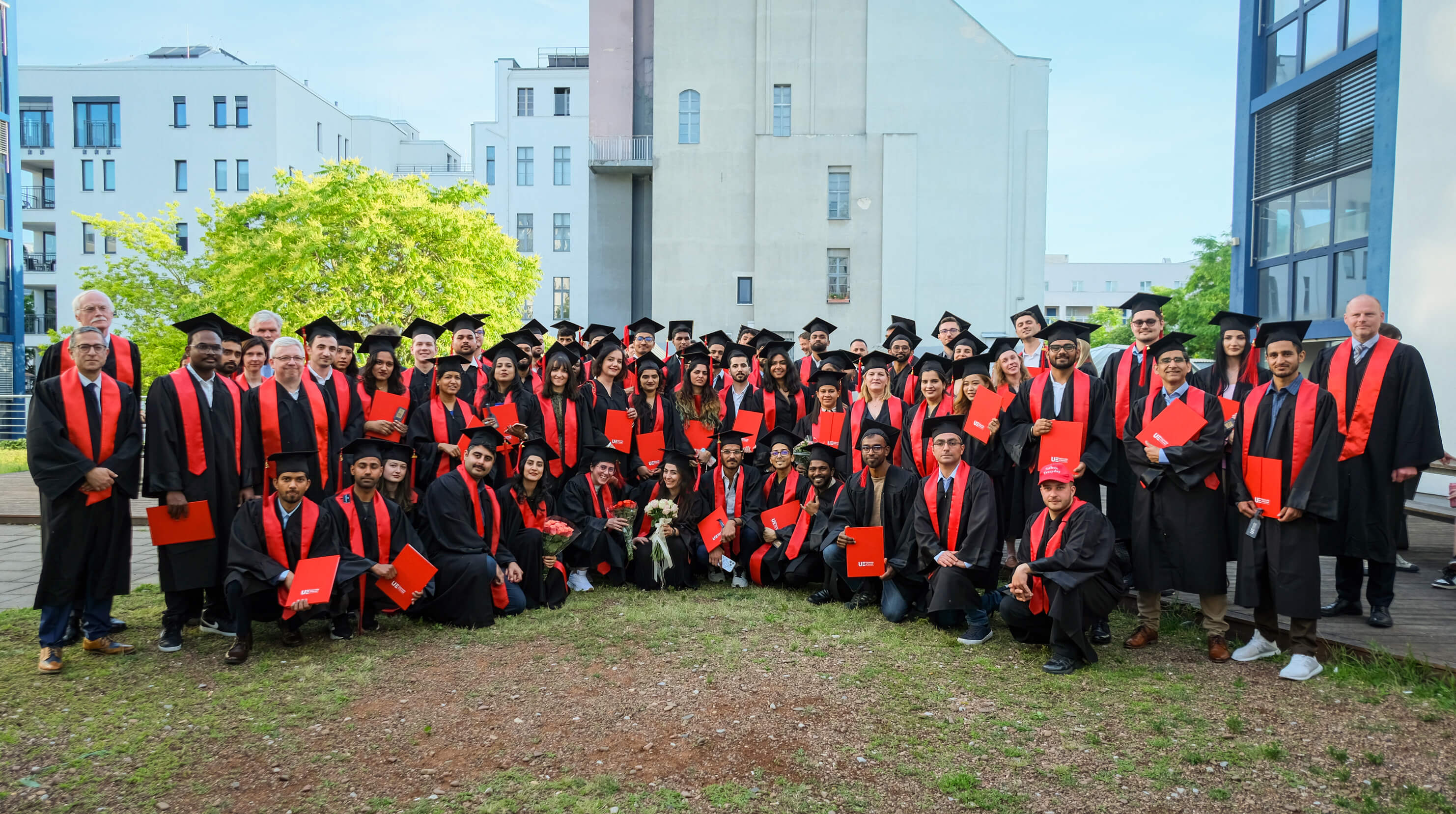 A group of graduates posing for a photo