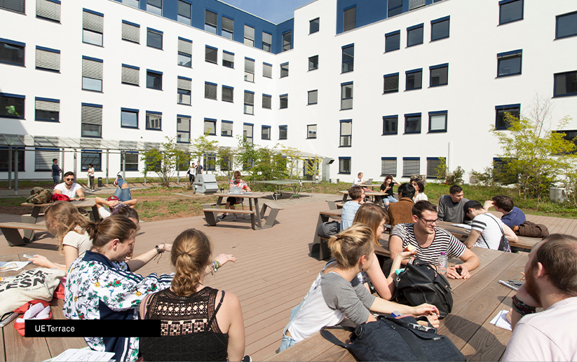 a group of people sitting outside