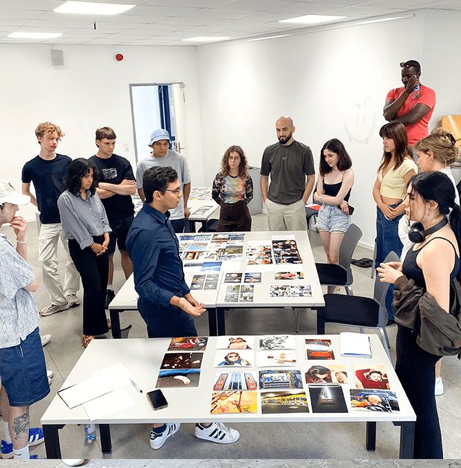 a group of people standing around a table with a game on it