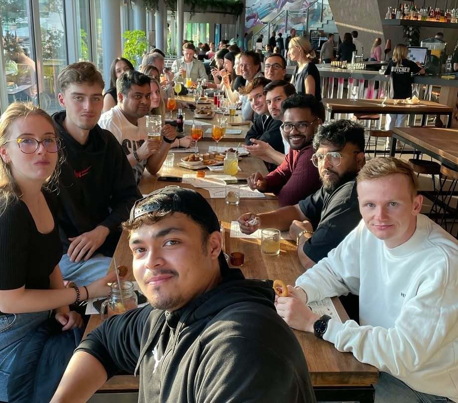 a group of people sitting at a table