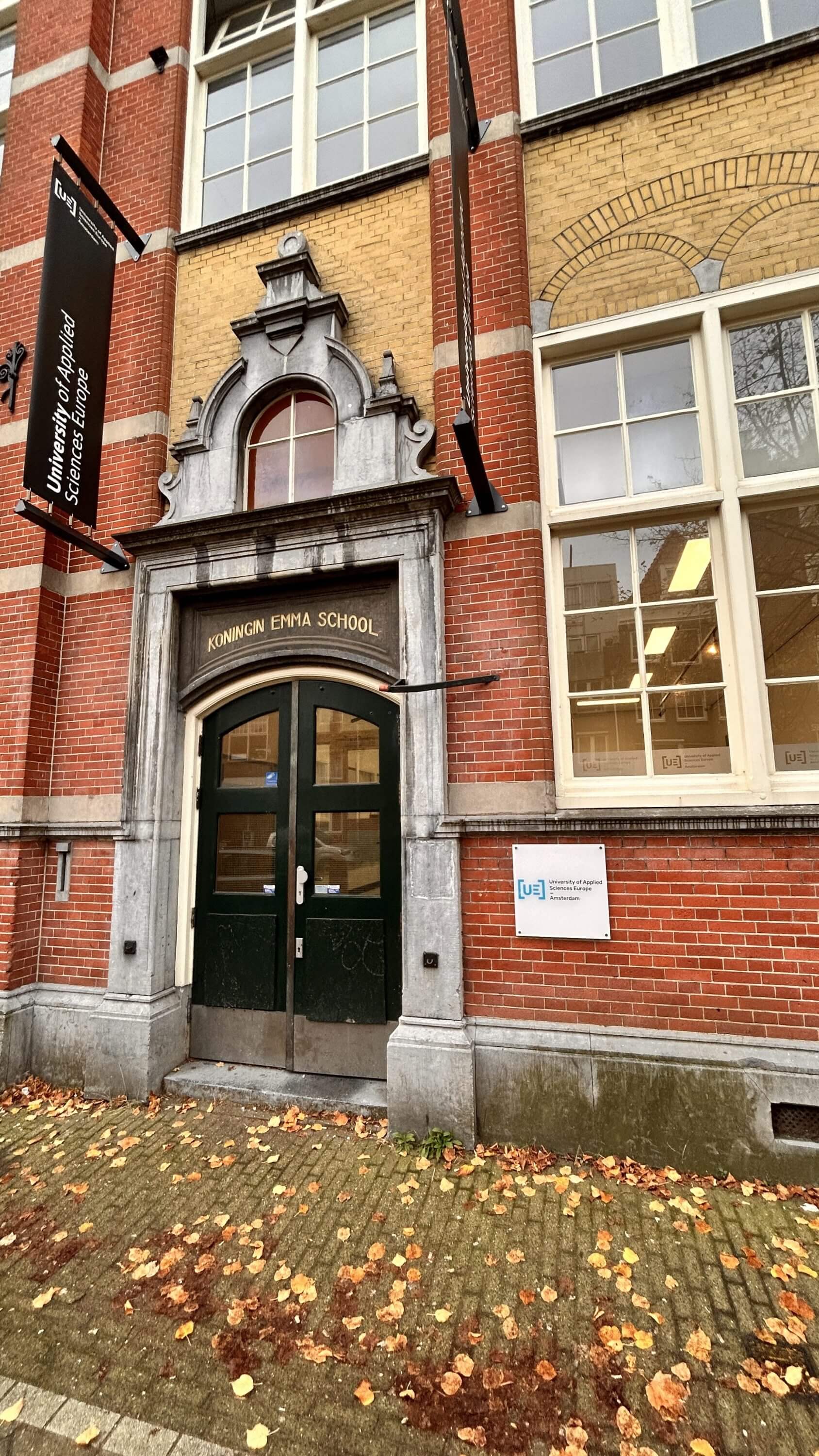 a brick building with a green door