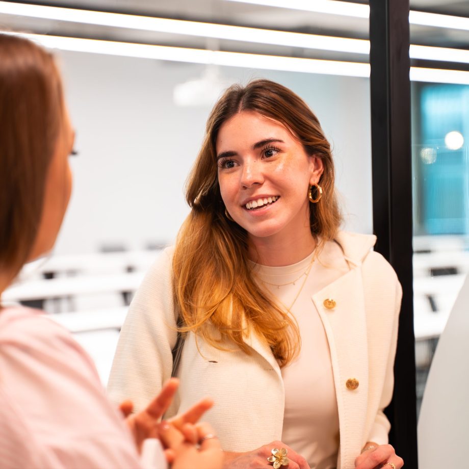 a woman talking to another woman