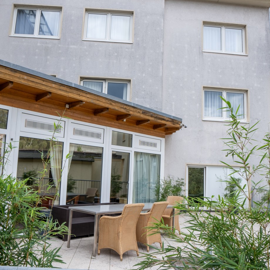 a table and chairs outside a building